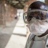 WHO upgrades Ebola threat level, stops short of sounding global alarm