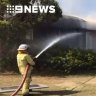 Firefighters battle to protect homes from raging industrial fire
