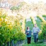 Food and drink haven: A couple stroll through the Mayfield vineyard in Orange, NSW.