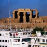 Age of contrasts ...  a cruise ship passes the ruins of Kom Ombo.