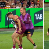 Brisbane Lions star Lincoln McCarthy helped off the ground during clash with Gold Coast Suns.