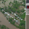 Queensland residents begin mopping up after record rain and flash flooding