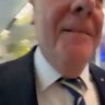 Peter Costello appears to knock over reporter