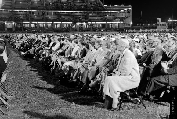 Thousands of people attend the Sydney Showground to listen to visiting US evangelist, Billy Graham, 13 April 1959.