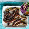 Barbecued sausages with red cabbage and mustard salad.