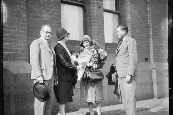 Wilhelm Backhaus and his wife are presented with flowers on their arrival in Sydney on April 22, 1930.