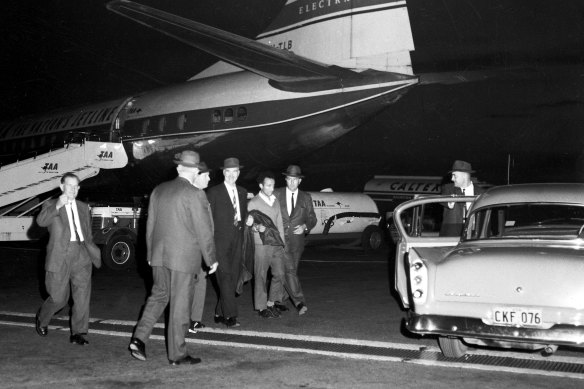 William MacDonald AKA The Mutilator arrives at Sydney's Mascot Airport from Melbourne to face possible murder charges on May 15, 1963.