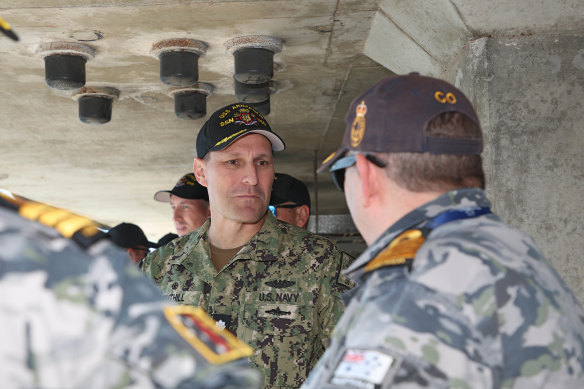 Commanding Officer of HMAS Stirling, Captain Ken Burleigh, RAN welcomes US Navy Commanding Officer of USS Annapolis Commander James Tuthill, and the Los Angeles-class submarine alongside Diamantina Pier at Fleet Base West, WA.