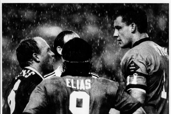 It's on: Wally Lewis and Mark Geyer eyeball each other at the SFS in 1991.