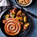 Lamb merguez sausage with sauerkraut, crushed potatoes and caraway butter.