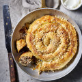 Serve this lamb, rice and vine leaf borek with garlic dip.