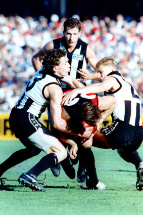 Defender Craig Kelly (back) in action during the 1990 premiership over Essendon.