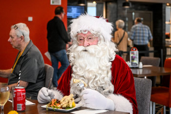 Santa Harold, aka Harold Connell, has a meal before his shift at Greensborough RSL.