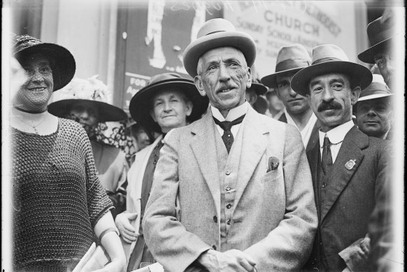 Prime Minister Billy Hughes standing with a crowd in Sydney on his return from the Paris Peace Conference in 1919.