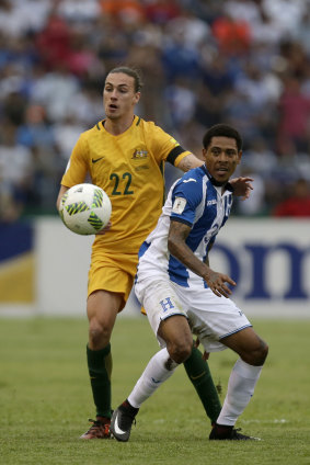 Australia's Jackson Irvine, left, with Honduras' Henry Figueroa 