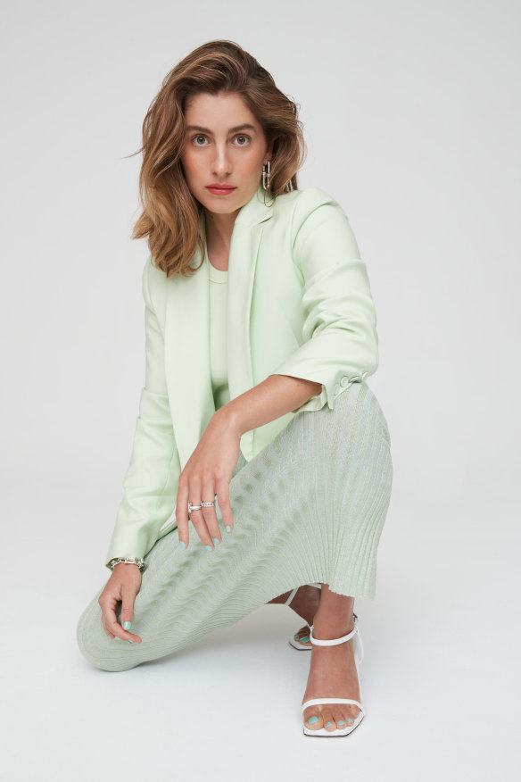  Viktoria & Woods “Rockefeller” blazer, $590, and “Lorne” tank, $100. Tory Burch skirt, $860. Tiffany & Co. bracelet, $2800, and 
rings, $9400 and $2800.