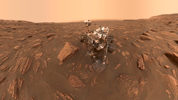 NASA rover Curiosity takes a selfie via a camera on the end of its robotic arm at Gale Crater on Mars. This panorama is made up of 57 individual images stitched together.