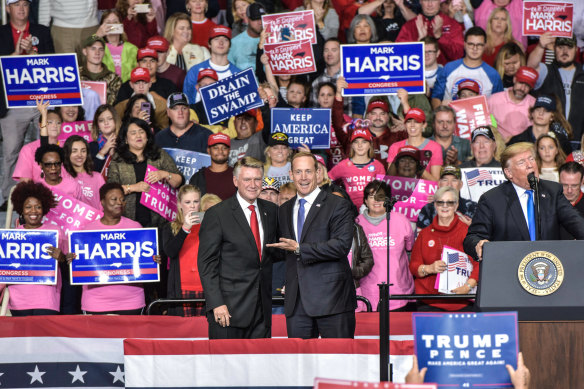 Mark Harris, left, and President Trump, far right, at a midterm rally for Harris in Charlotte.