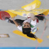 Fans cheer, clap as climber who competed without headscarf returns to Iran
