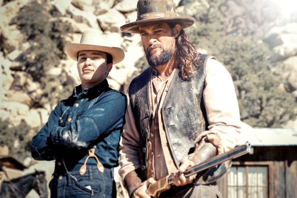 Mojean Aria (left) on set with Jason Momoa.