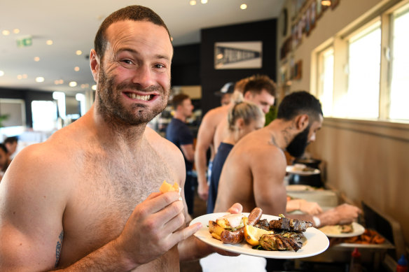 Tasty treats: Captain Boyd Cordner looks pleased with his feed, we think.