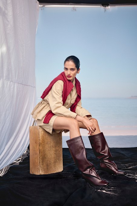 Weekend Max Mara jacket, $1030, and shorts, $615. Viktoria & Woods “Graduate” cardigan, $350. Zara boots, $389.