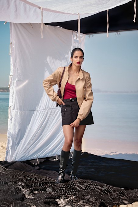 Weekend Max Mara jacket, $1030, and shorts, $615. Viktoria & Woods “Graduate” cardigan, $350. Zara boots, $389.