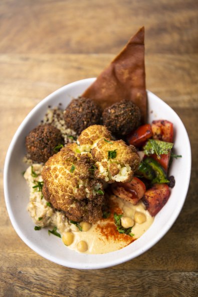 The Khamsa Cafe Jerusalem Bowl with hummus, baba ghanoush, quinoa, fattoush, falafel and cauliflower. 