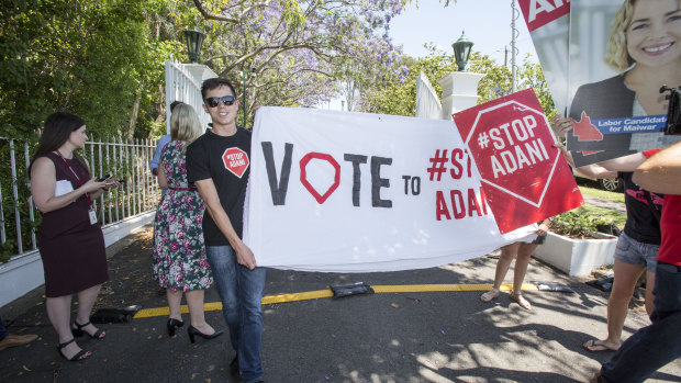 Anti-Adani protesters gathered outside the gates of Government House.