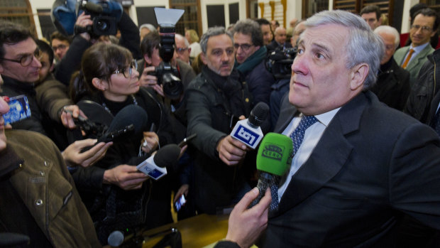 Antonio Tajani answers reporters' questions in Rome. He is widely believed to be Berlusconi's preferred surrogate for the prime ministership. 