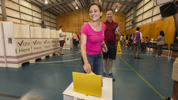 Deputy Premier Jackie Trad casts her ballot at a voting station at West End State School on Saturday.