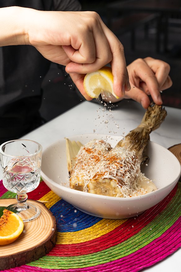 Char-grilled corn with smoked mayo, cotija cheese, Tajin and lemon at Maiz y Cacao.
