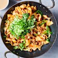 Crispy chilli oil adds its ineffable charm to this peanutty pork and noodle stir-fry.