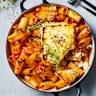Tomato, harissa and chickpea pasta with charred hot honey feta.