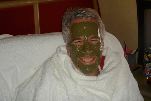 Jeffrey Epstein appears to get a facial treatment in another photograph.