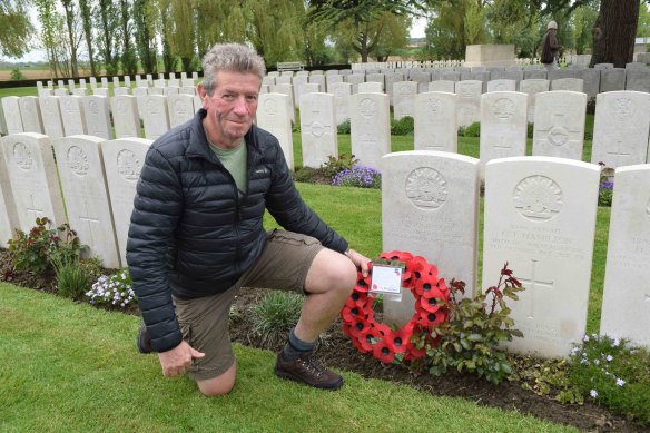 Article author, David Ellery, at the grave of a relative, Albert Goodacre, from Woodstock near Cowra in NSW who was mortally wounded on October 4, 1917. 