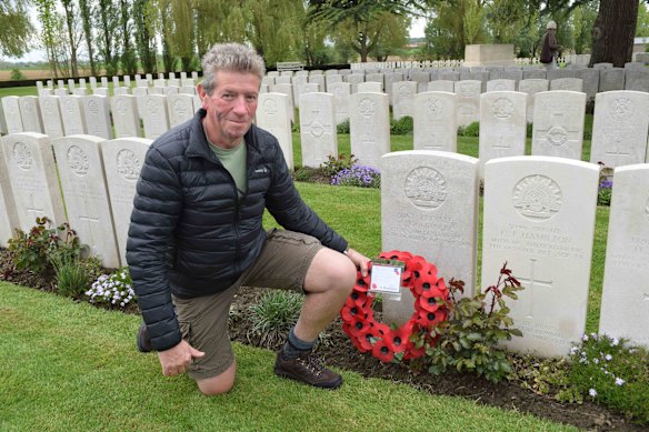 Article author, David Ellery, at the grave of a relative, Albert Goodacre, from Woodstock near Cowra in NSW who was mortally wounded on October 4, 1917. 