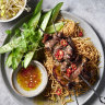 Vietnamese beef skewers with crispy noodles.