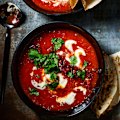 Creamy chipotle tomato soup with crispy chorizo and toasted seeds.