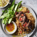 Vietnamese beef skewers with crispy noodles.