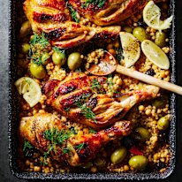 Sticky pomegranate and cous cous chicken tray bake.