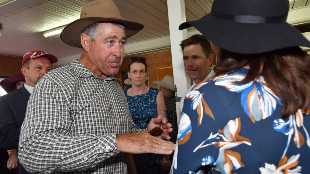 Local farmer Jim Hancock confronts Premier Annastacia Palaszczuk about vegetation management at the Kumbia Race Club.