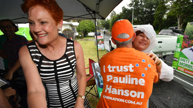 Pauline Hanson (left) and former One Nation senator Malcolm Roberts (centre) with Jo-Ann Miller (right) in Bundamba on Tuesday.