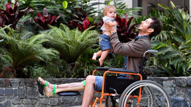 The world's first patient to receive a 3D-printed tibia transplant, Reuben Lichter, with his son, William.