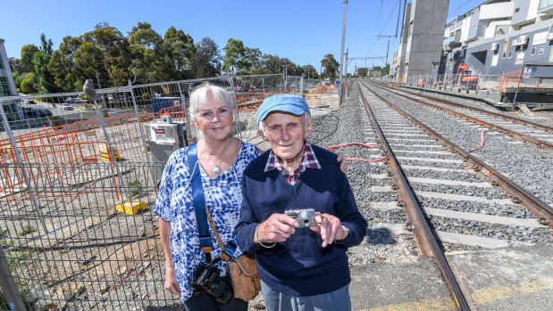 Julie Schneider, left, pictured with her train fanatic father George Wernicke at Rosanna Station. The station is being rebuilt as part of level crossing removals.