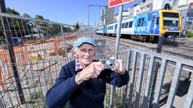 Got to get that shot: George Wernicke, pictured at Rosanna station, has hung out, and taken 10,000 photos, at level crossings removal and skyrail construction sites across Melbourne.