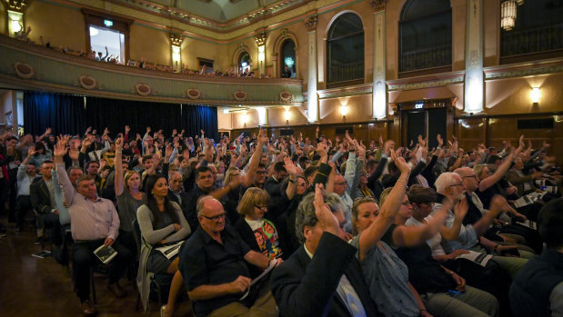 Trinity Grammar community members give the school council a vote of no confidence in a meeting at Hawthorn Town Hall on Tuesday night.