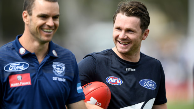 Patrick Dangerfield (right) with Cats assistant coach Matthew Scarlett.