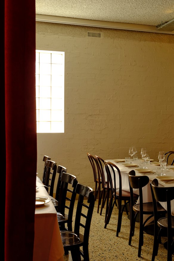 A curtained-off private dining room lies at the rear.