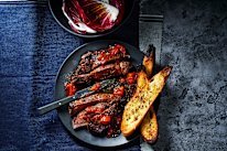 This easy steak dish is packed with flavour thanks to roasting tomatoes with anchovies and garlic.